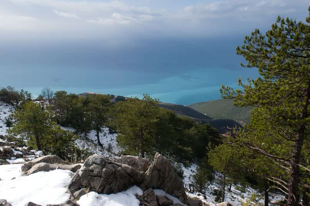 Stunning mountainous landscape with snow and sea in Elbasan County, Albania.