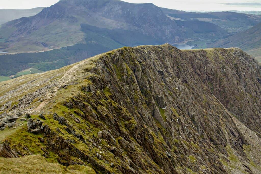 green and brown mountain under blue sky during daytime at Snowdonia National Park | 10 Mount Ascents for Beginners