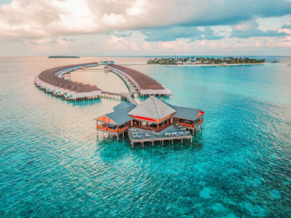 aerial photography of Maldives resort rooms and island