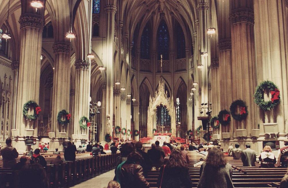 Interior of St. Patrick's Cathedral, New York, U.S., decorated on Christmas Eve