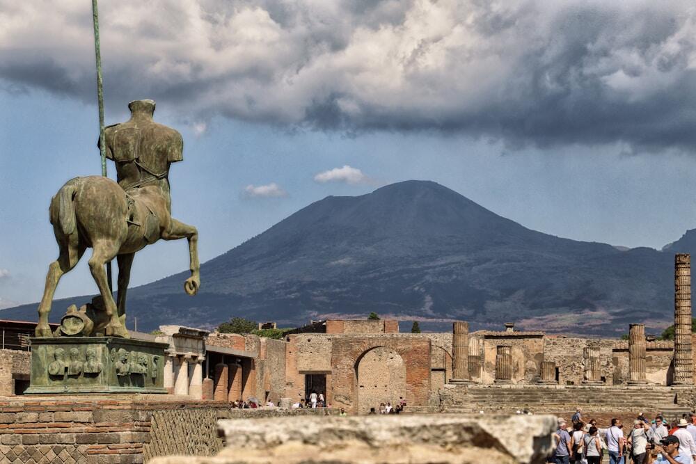 Igor Mitoraj sculpture on the side of Pompei with the Vesuvio view.
