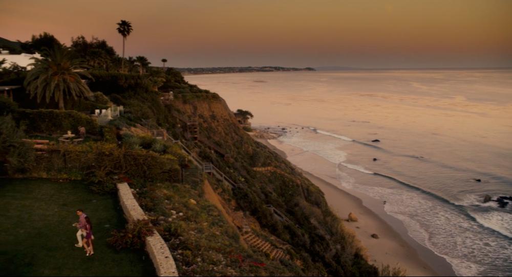 Sunset cliff view of a Malibu beach house in Just Go With It